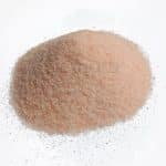 A close-up photo of a Himalayan Dark Pink Salt Fine Grain on a white background
