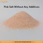 A pile of Himalayan Dark Pink Salt Fine Grain on a white background.