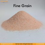 A pile of fine-grained Himalayan Dark Pink Salt on a white surface with black text at the bottom that says "SALT Fine Grain info@demarosalt.com Demaro Salt. All Rights Reserved. +92 3001357086".