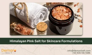 Himalayan pink salt used as a natural mineral ingredient in skincare formulations, displayed with cosmetic laboratory glassware