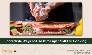 Himalayan salt blocks and crystals used in a rustic kitchen setting for cooking and serving.